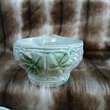 Antique cup and saucer in majolica.