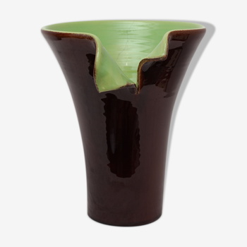 Brown and green vase with open edge rolled up