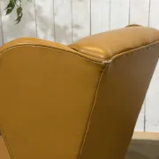 Pair of 1980s English wingback armchairs in leather.