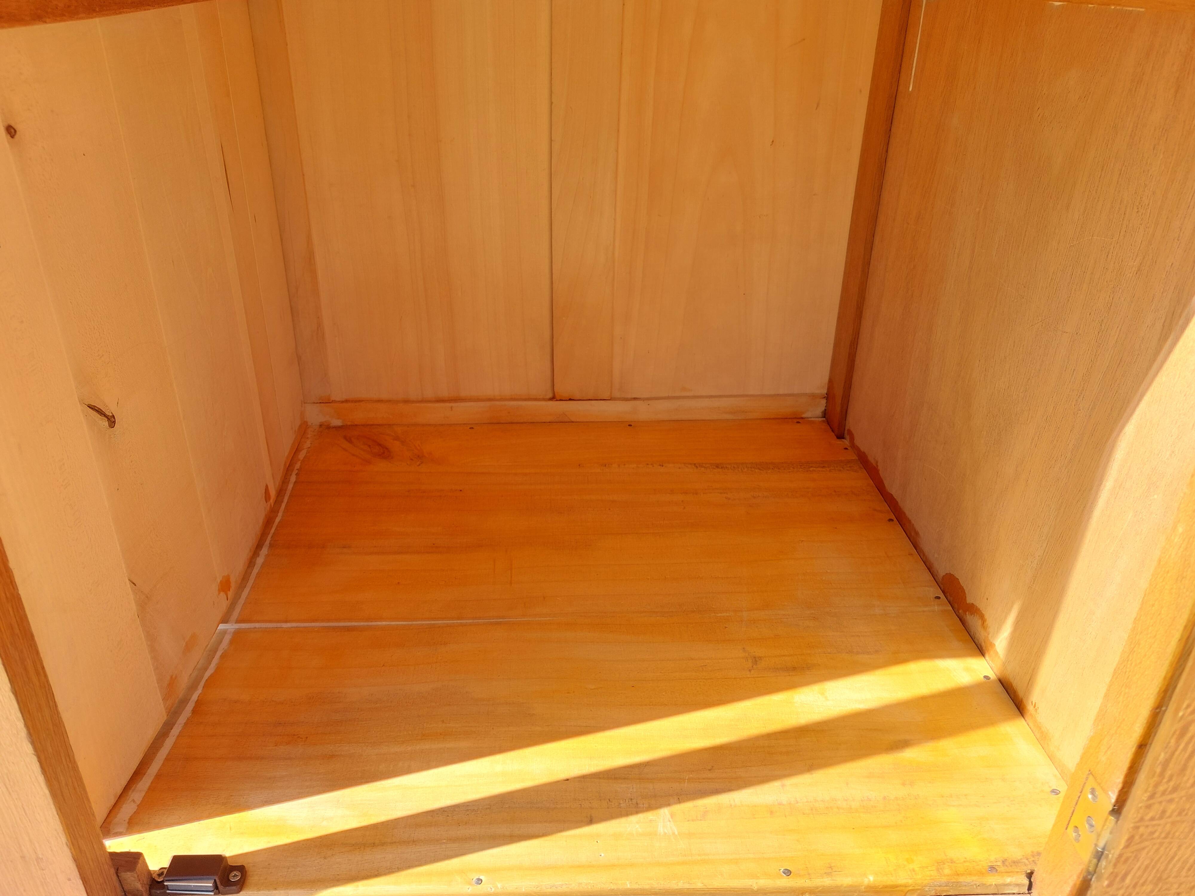 Vintage wardrobe with mirror and tapered legs.