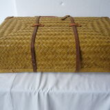 Old rattan case with leather straps and wooden handle
