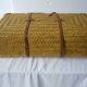 Old rattan case with leather straps and wooden handle