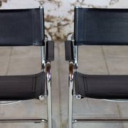 Pair of Bauhaus cantilever armchairs in chromed metal and leather, 1970