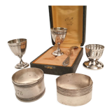 3 shells and 2 silver metal napkin rings