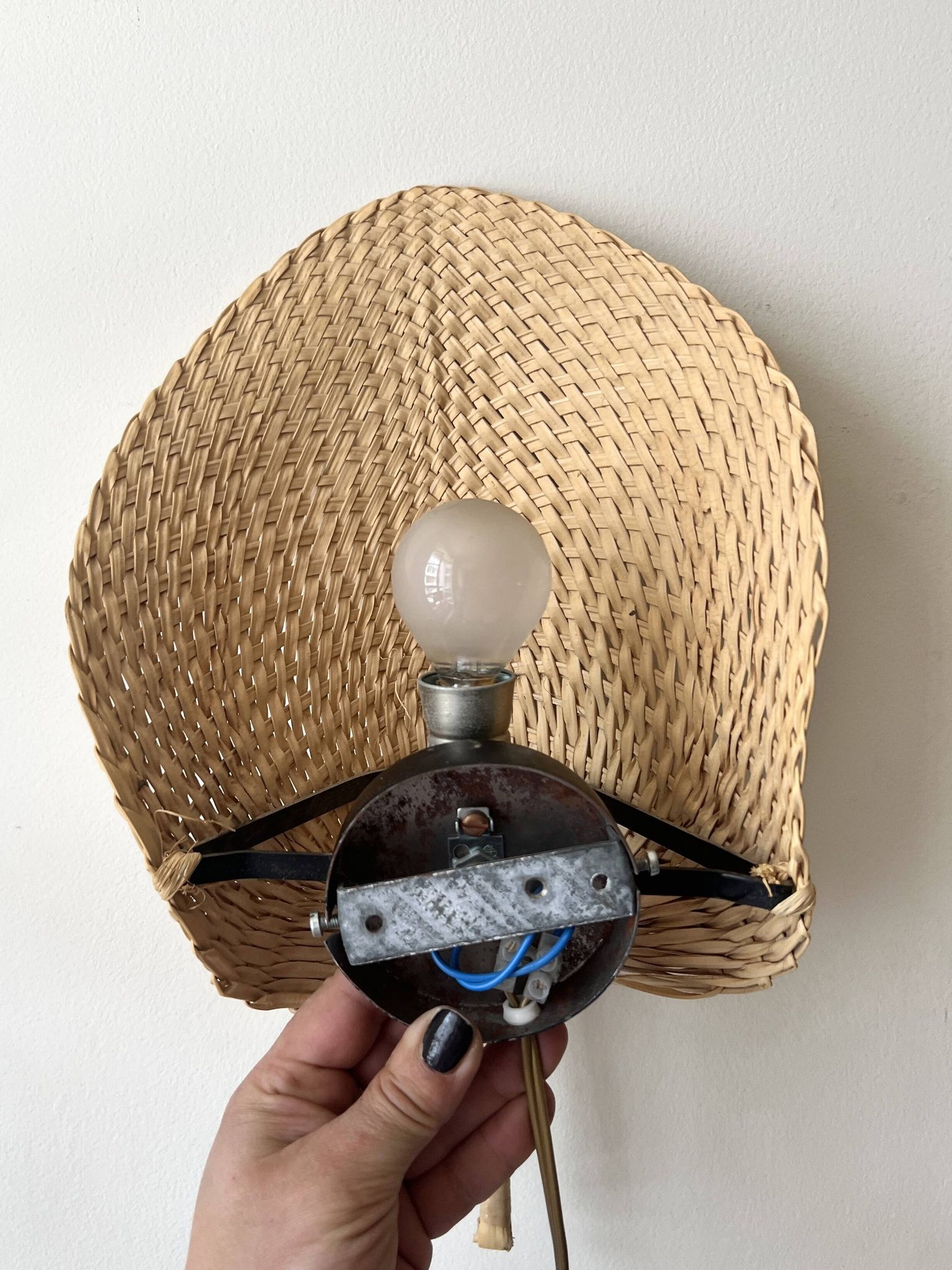 Woven rattan wall light in the style of Igno Maurer, design from the 1970s.