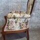 Louis XV style armchair with floral jacquard upholstery.