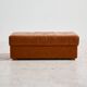 Ottoman with leather upholstery