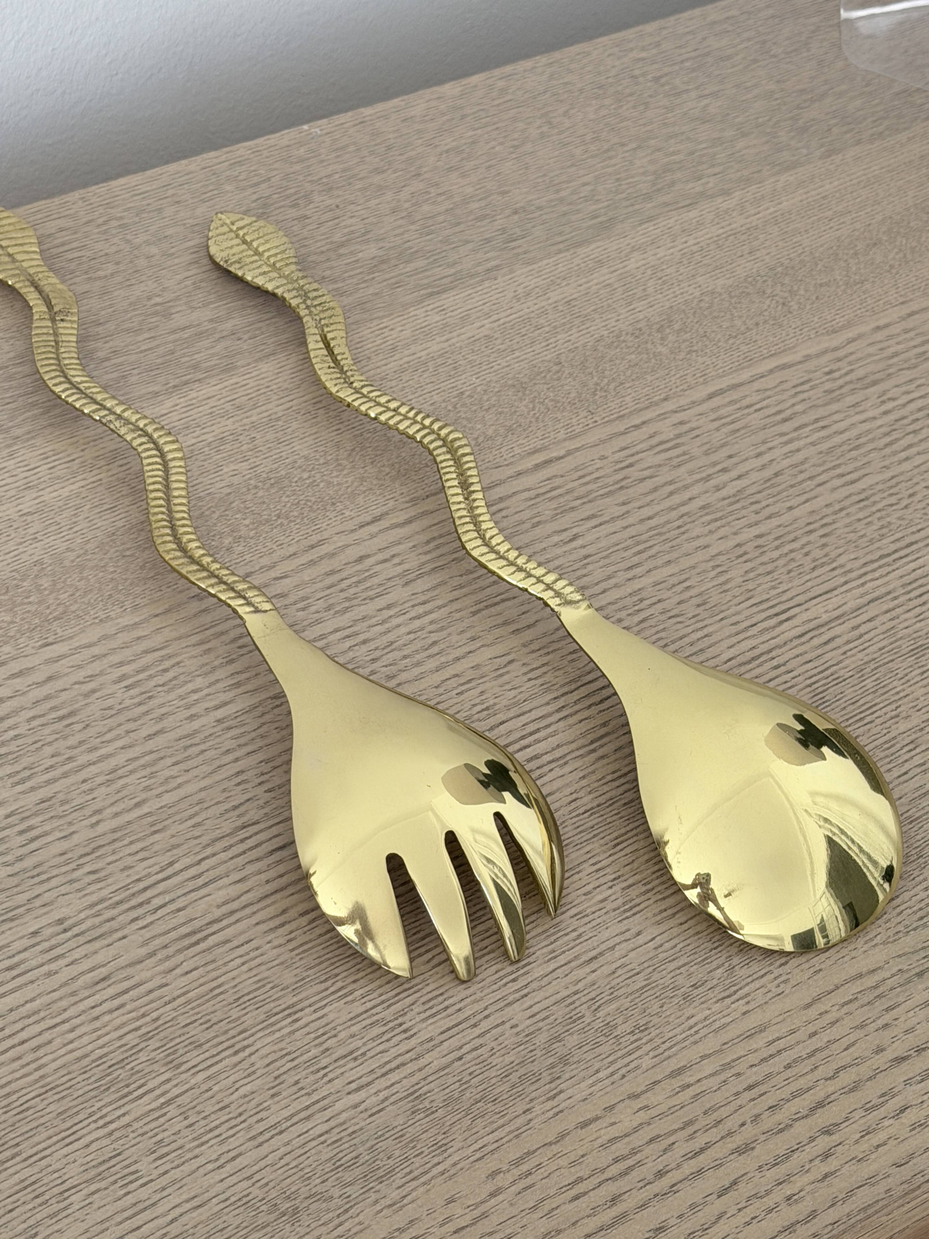 Gold metal snake salad serving set