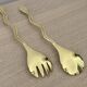 Gold metal snake salad serving set