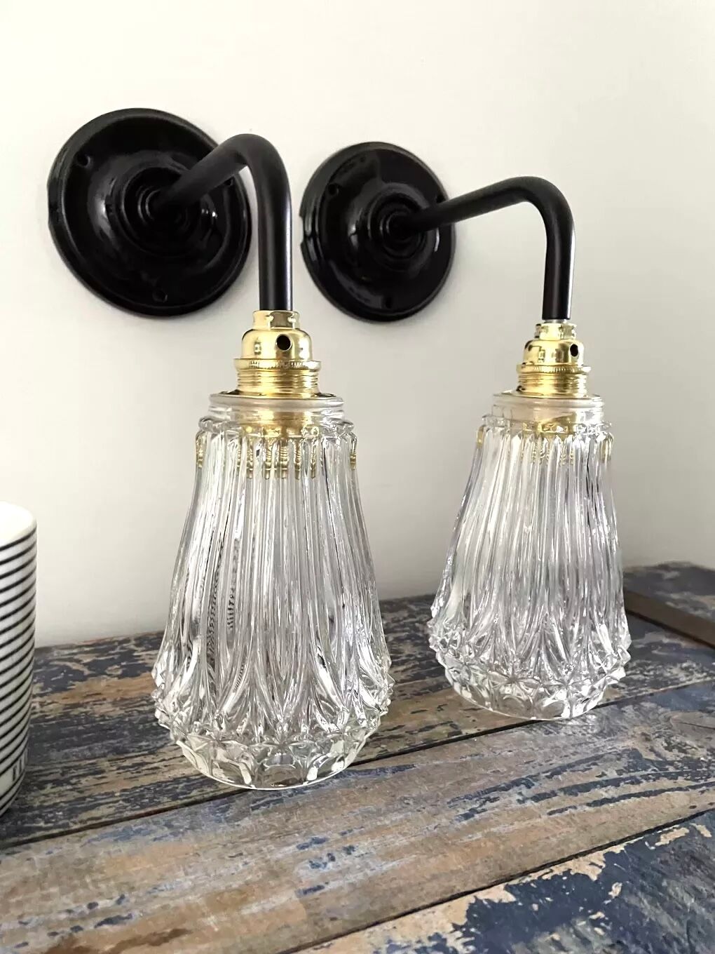 Set of two electrified chiseled glass sconces to nine