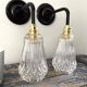 Set of two electrified chiseled glass sconces to nine