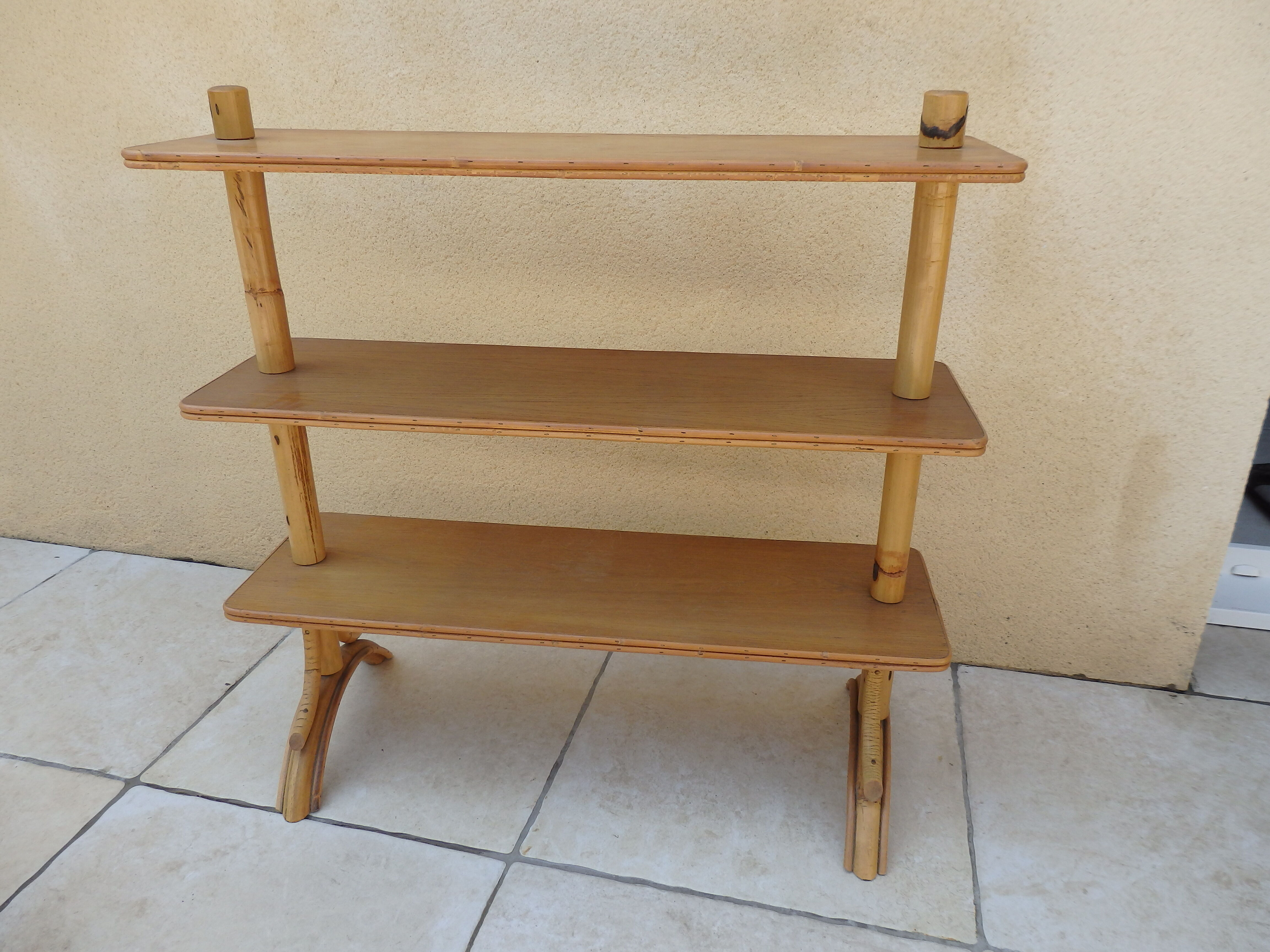 Vintage rattan shelf on feet