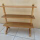 Vintage rattan shelf on feet