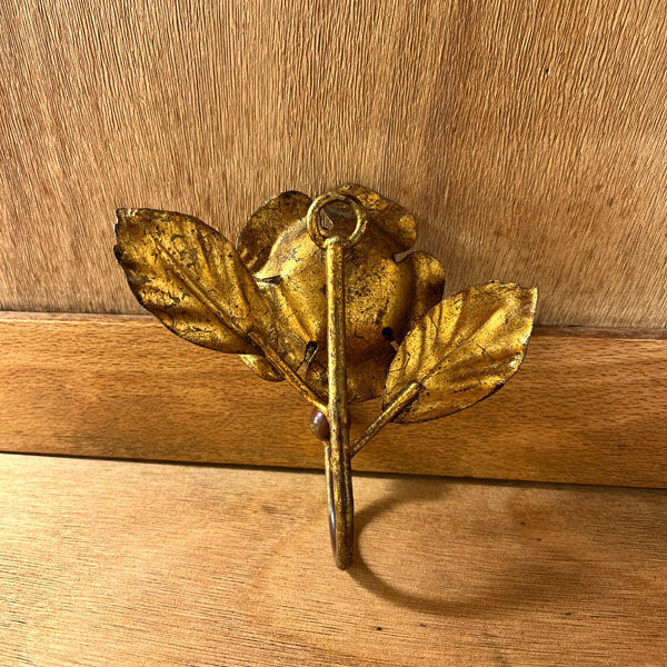 Pink-shaped hook in gilded metal