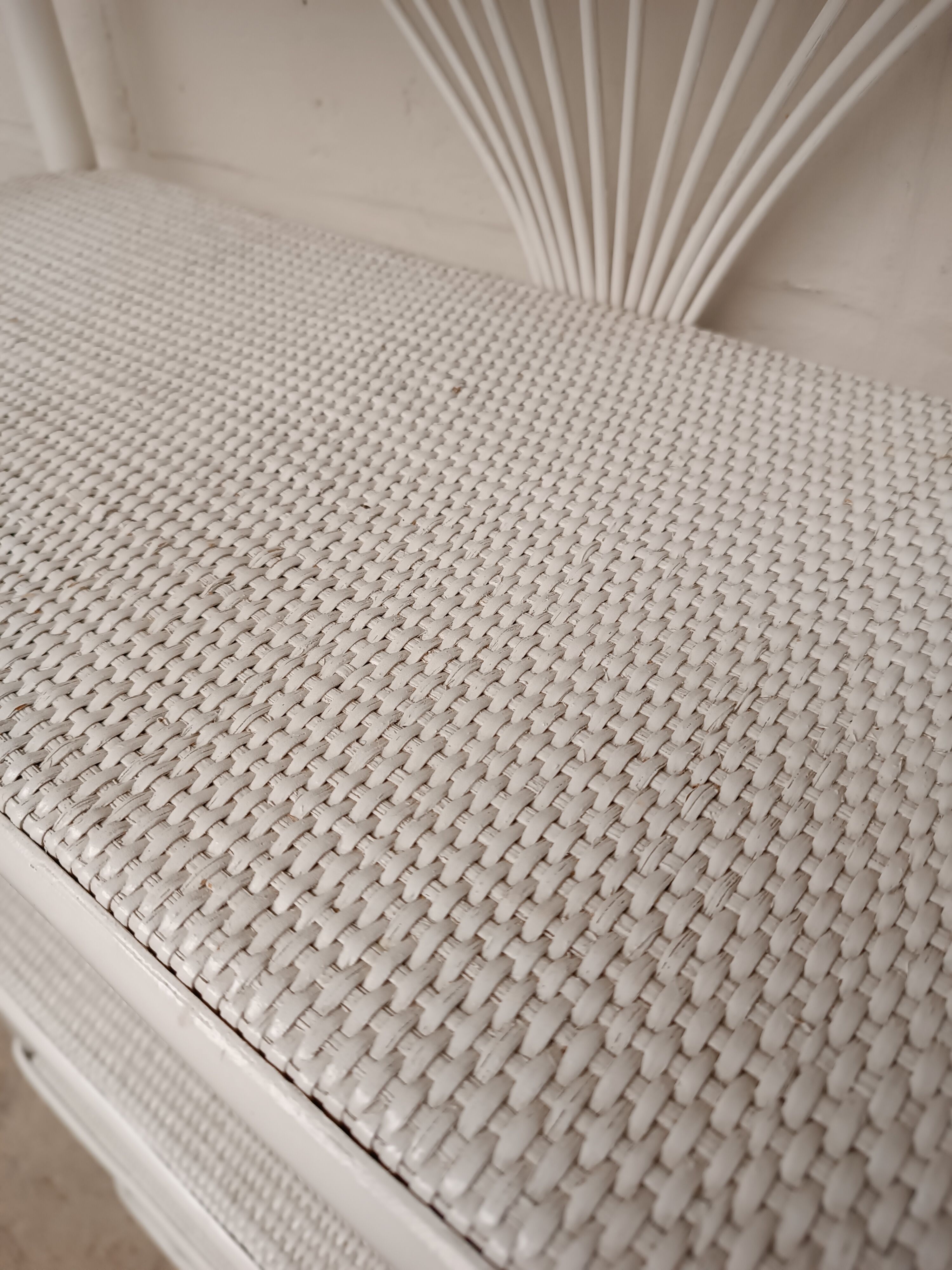 White lacquered rattan bookcase