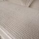 White lacquered rattan bookcase
