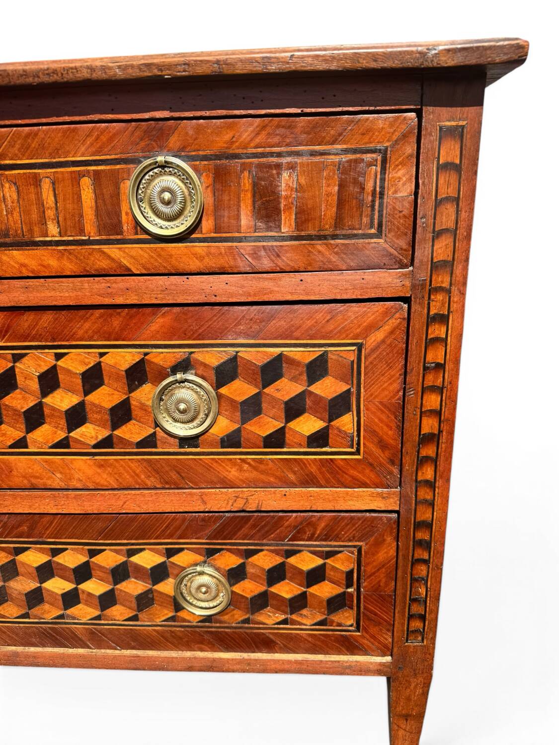 Louis XVI commode with marquetry featuring a design of precious wood cubes, 18th century.