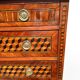 Louis XVI commode with marquetry featuring a design of precious wood cubes, 18th century.