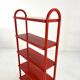 Red tubular leg shelf, 1980