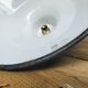 Pair of enamelled sheet metal suspensions