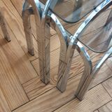 Trundle table in tubular steel and smoked glass
