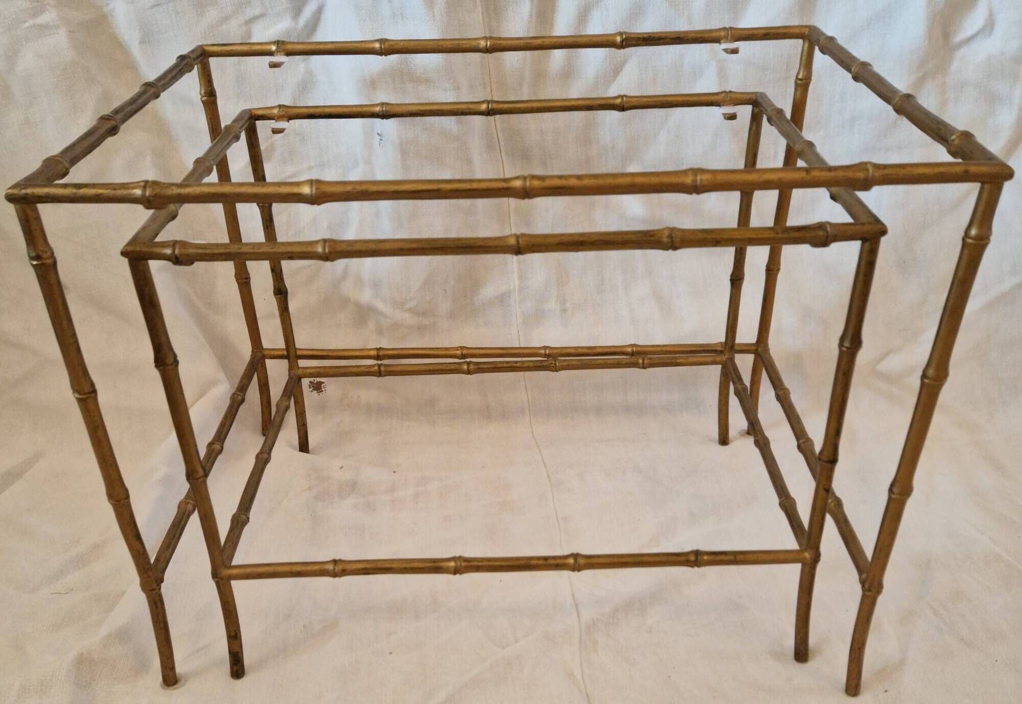 Pair of vintage nesting tables in faux bamboo with a gold finish – distressed mirrors
