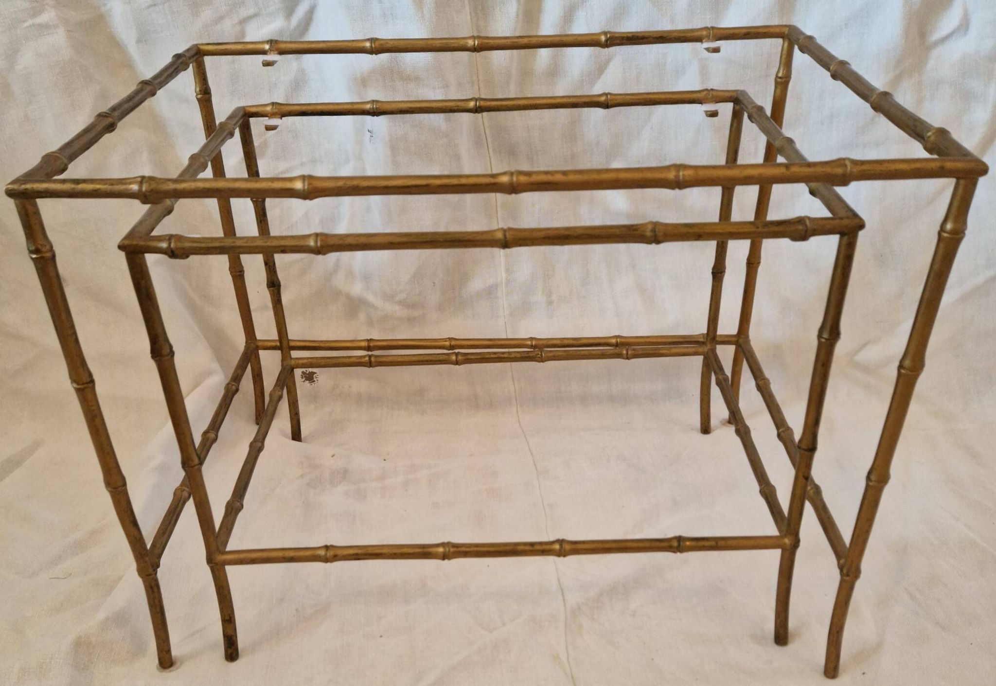 Pair of vintage nesting tables in faux bamboo with a gold finish – distressed mirrors