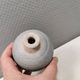 A small, round, beautiful ceramic vase from Denmark, dating from the 1980s.