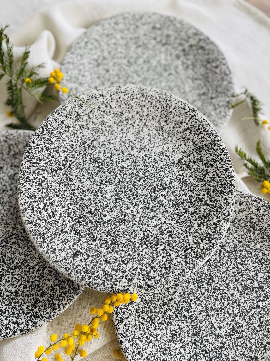 Set of 4 speckled black and white ceramic plates made in Italy