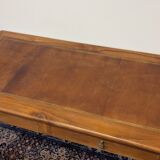Cherry wood desk with a leather top.