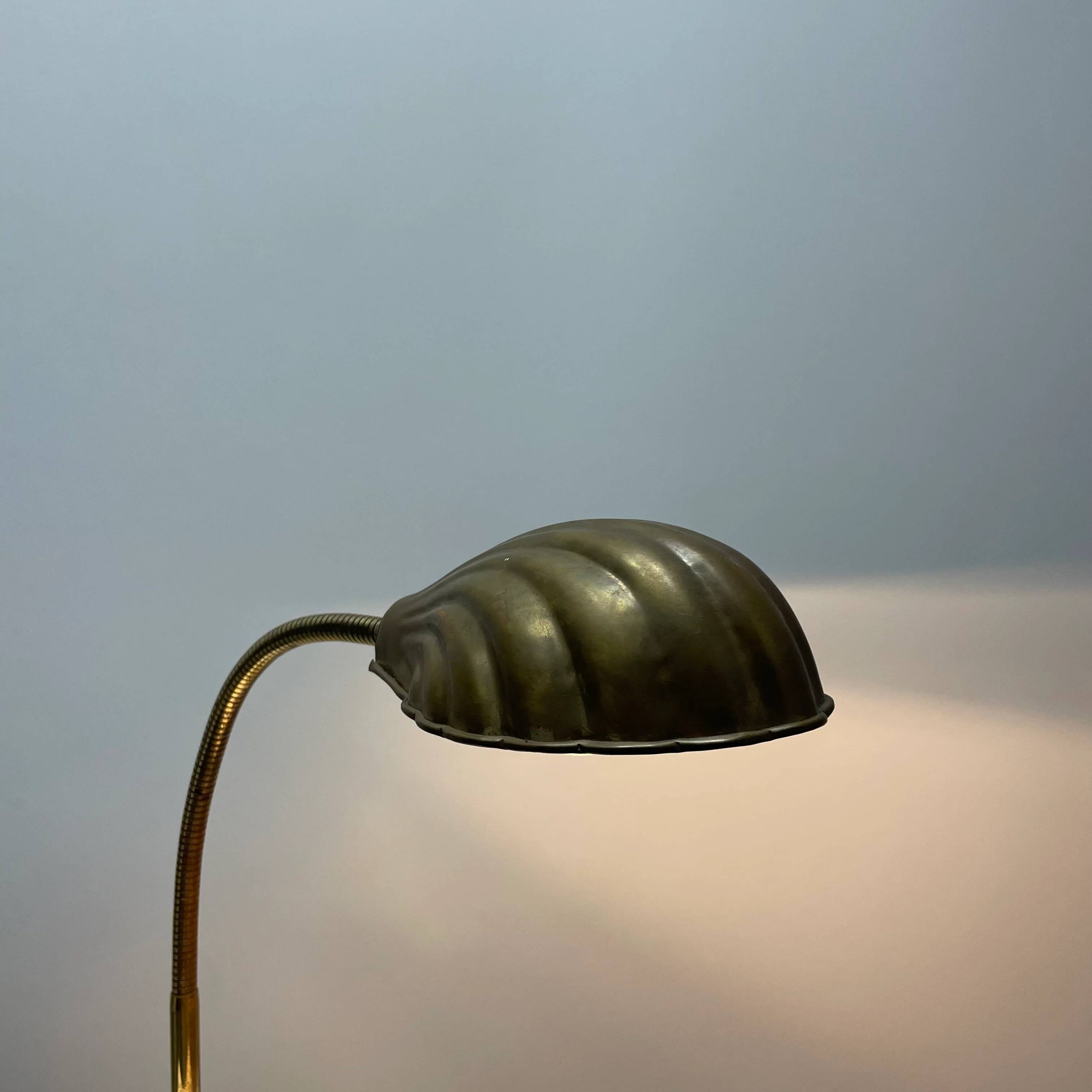 French table lamp in brass with a shell-shaped shade from the 1950s.