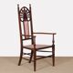 English armchair attributed to J.S. Henry, late 19th century.