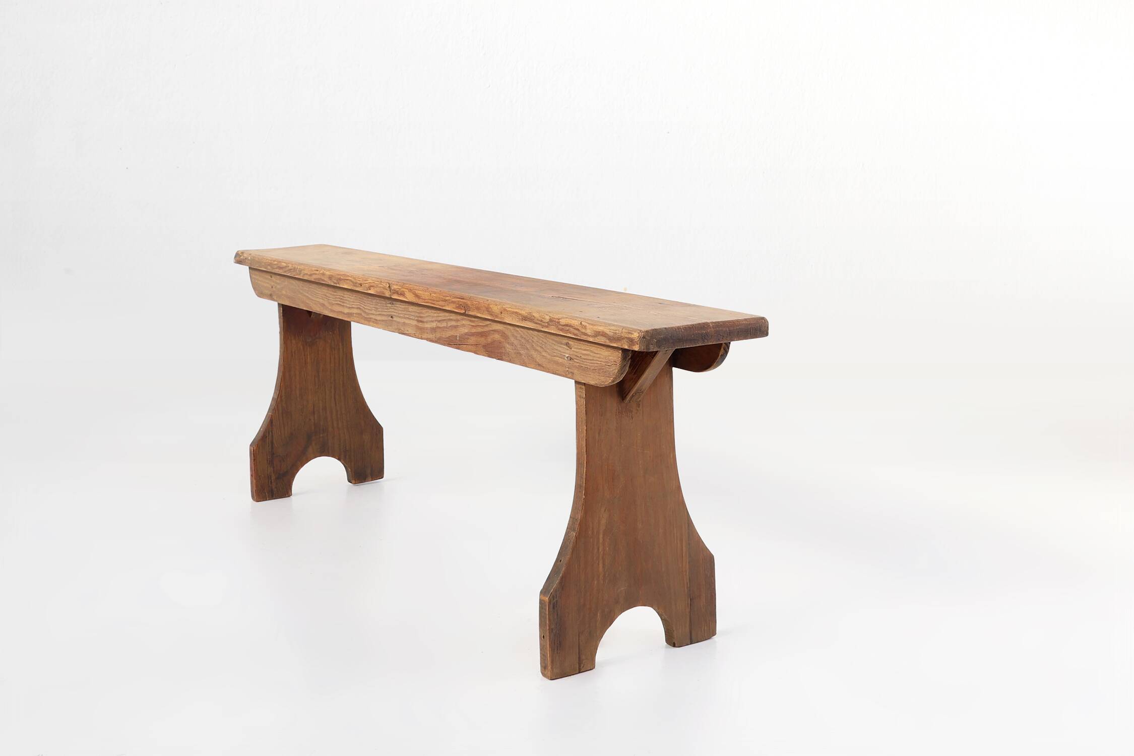 Rustic natural oak wooden bench with rounded details, France ca. 1900