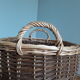Very large oval laundry basket in two-tone braided wicker with handles