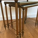 Pull-out tables in golden brass and marble