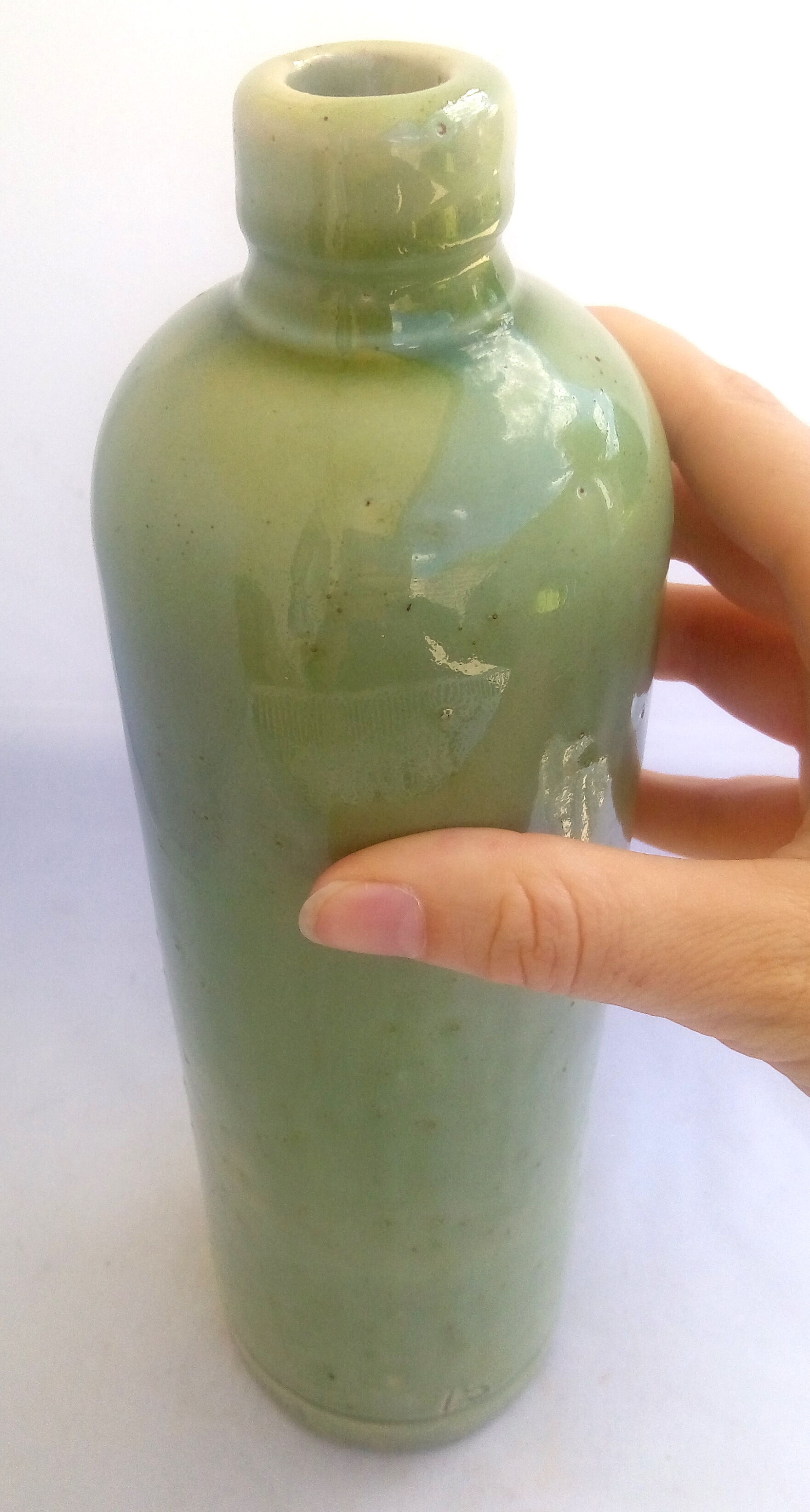 Apple green enamelled sandstone bottle