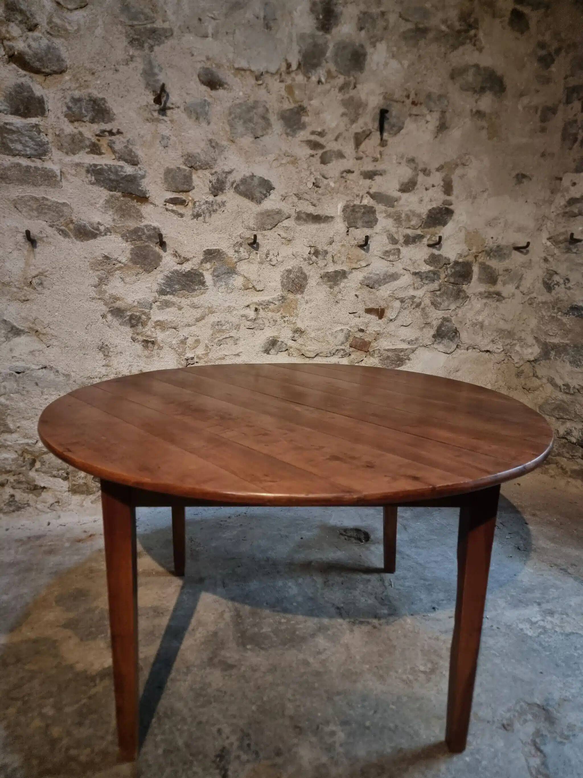Antique round dining table in cherry wood, France, circa 1920.