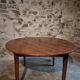 Antique round dining table in cherry wood, France, circa 1920.