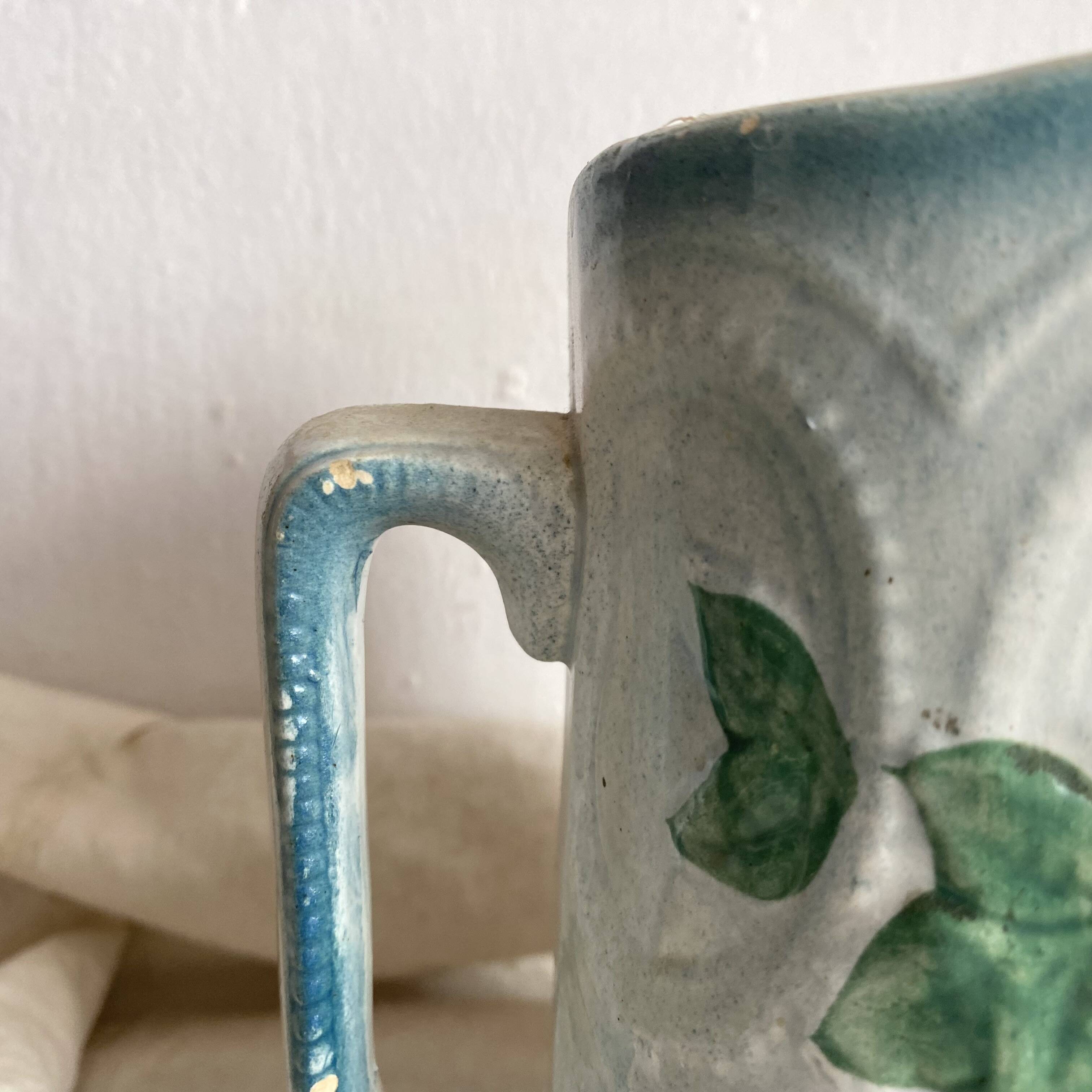 Art Nouveau slip pitcher with roses