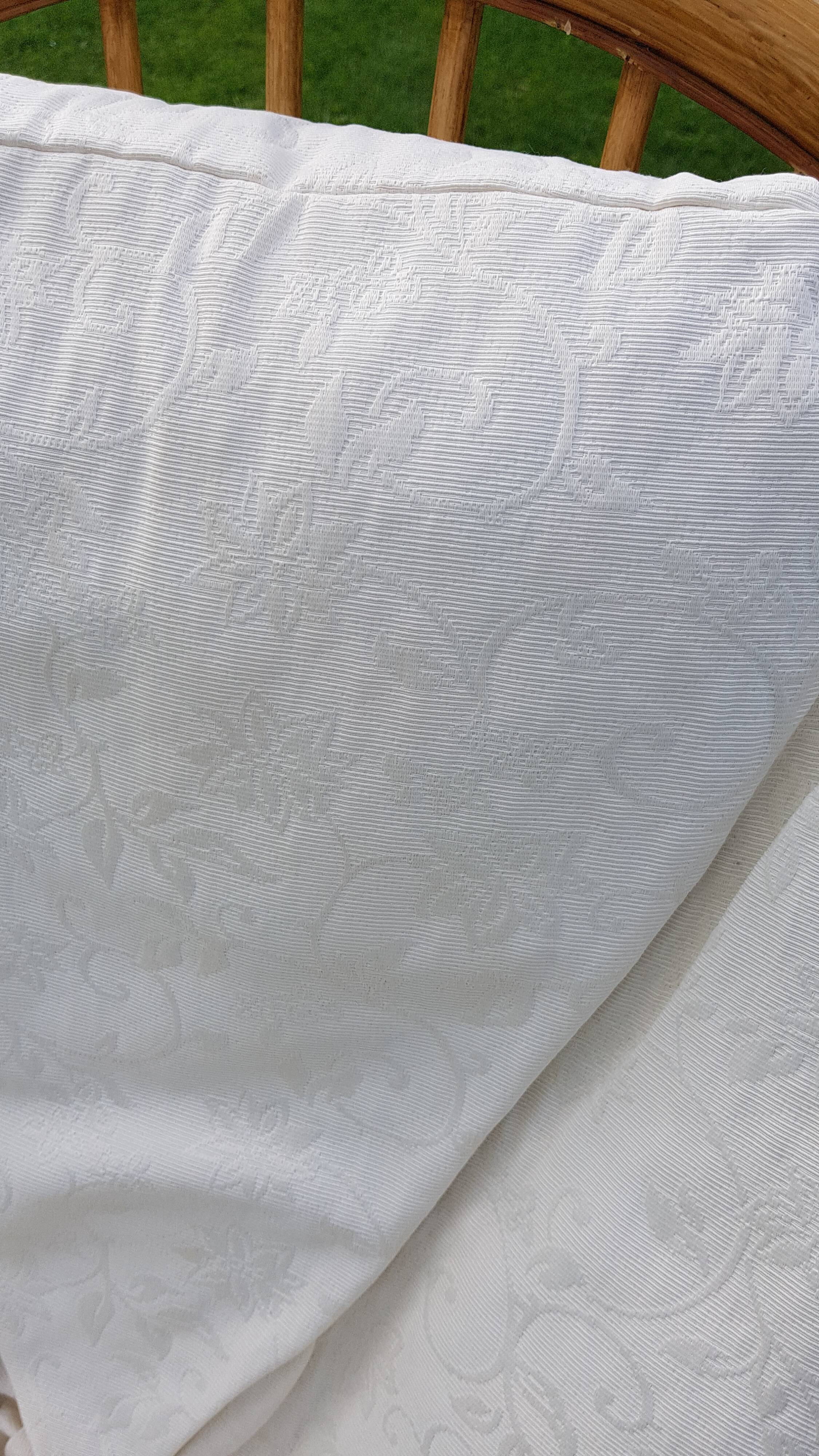 Pair of swivel rattan armchairs