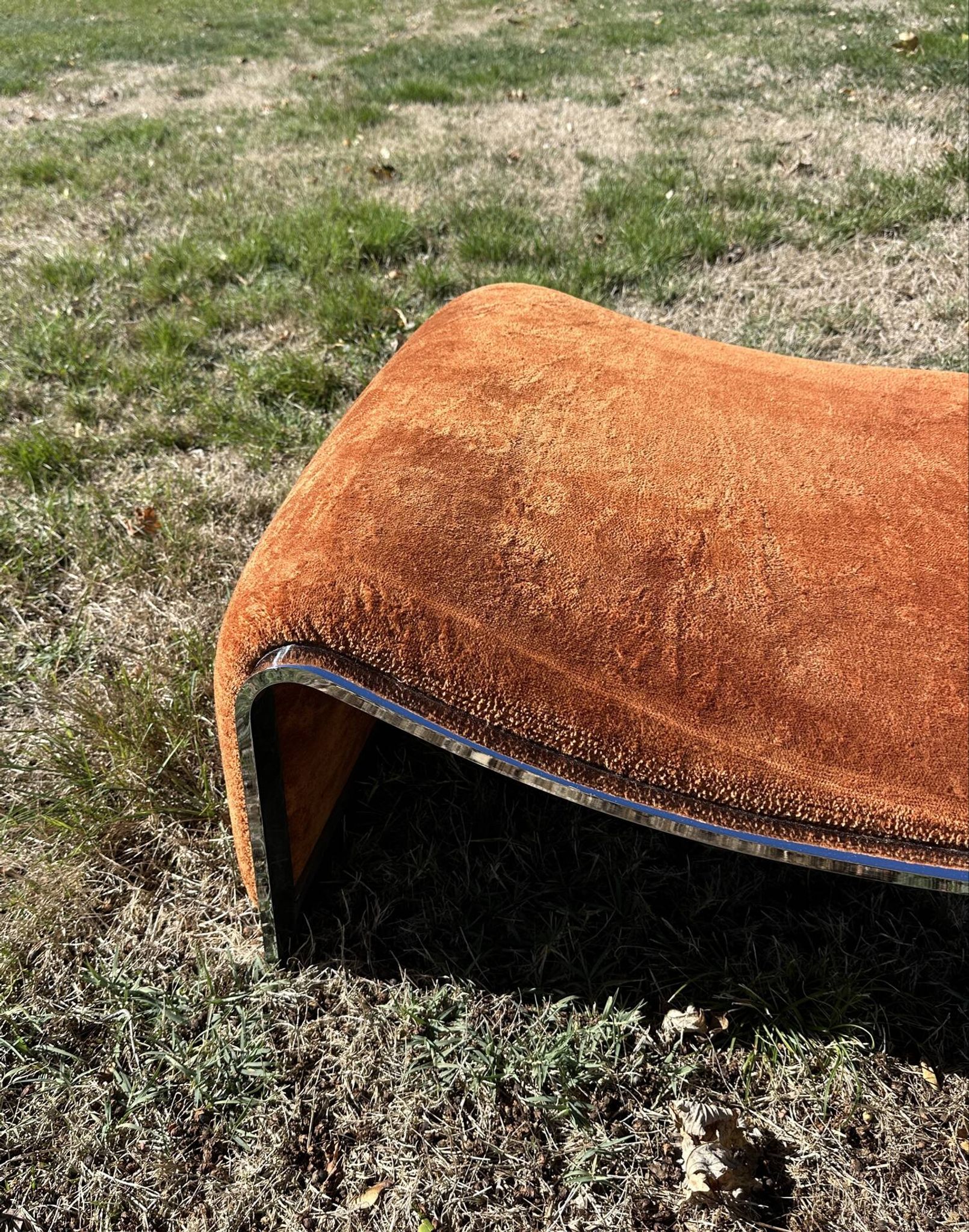 Chrome steel armchair and orange fabric by Vittorio Introini