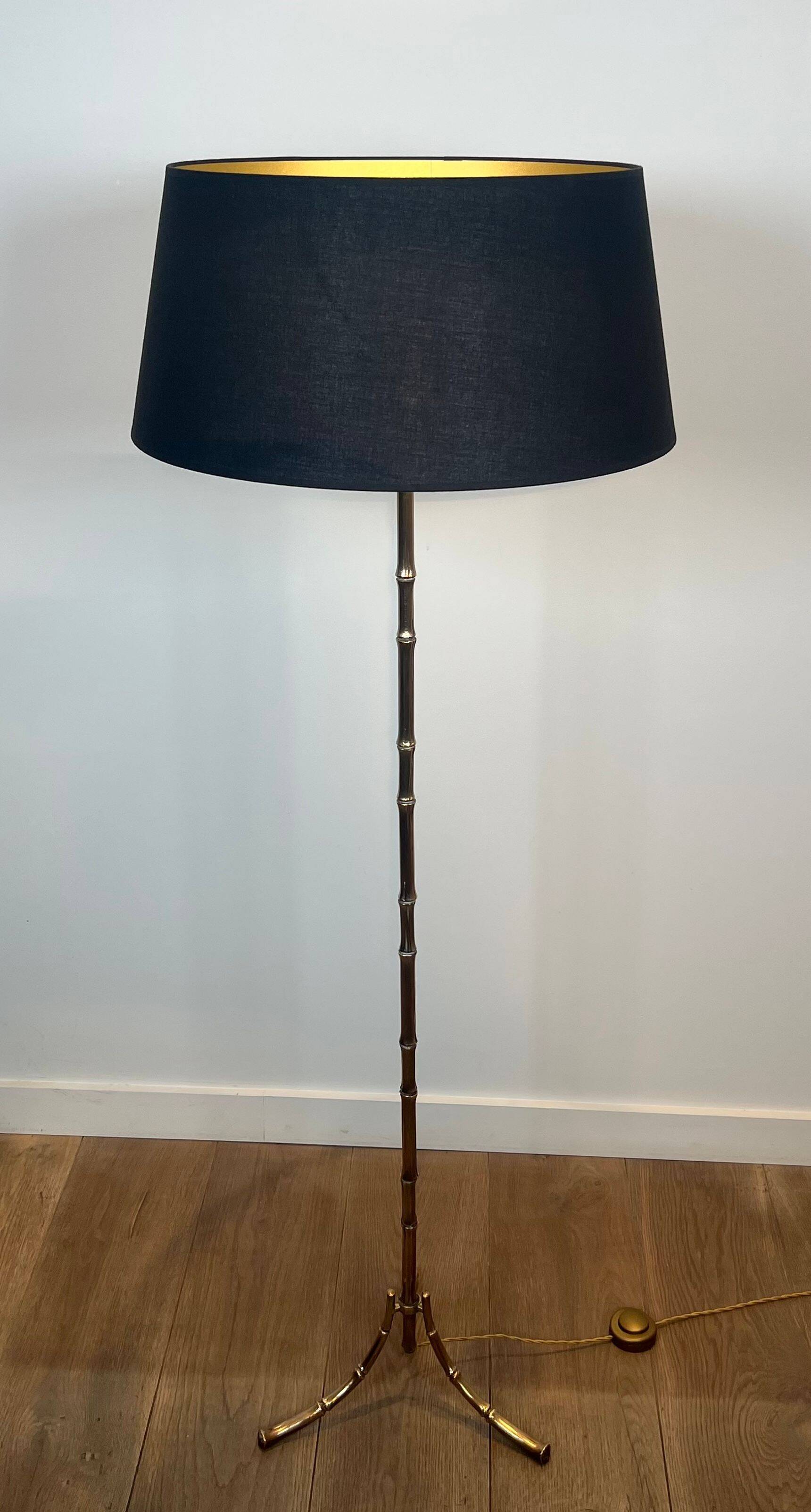 Bronze floor lamp in faux-bamboo style by Maison Baguès.