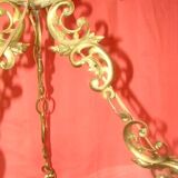 circular chandelier with a brass frame equipped with crystal drops