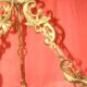 circular chandelier with a brass frame equipped with crystal drops