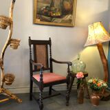 Carved wooden armchair and cannage