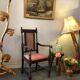 Fauteuil en bois sculpté et cannage