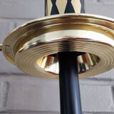 Vintage floor ashtray with a gold and black metal cigarette dispenser.