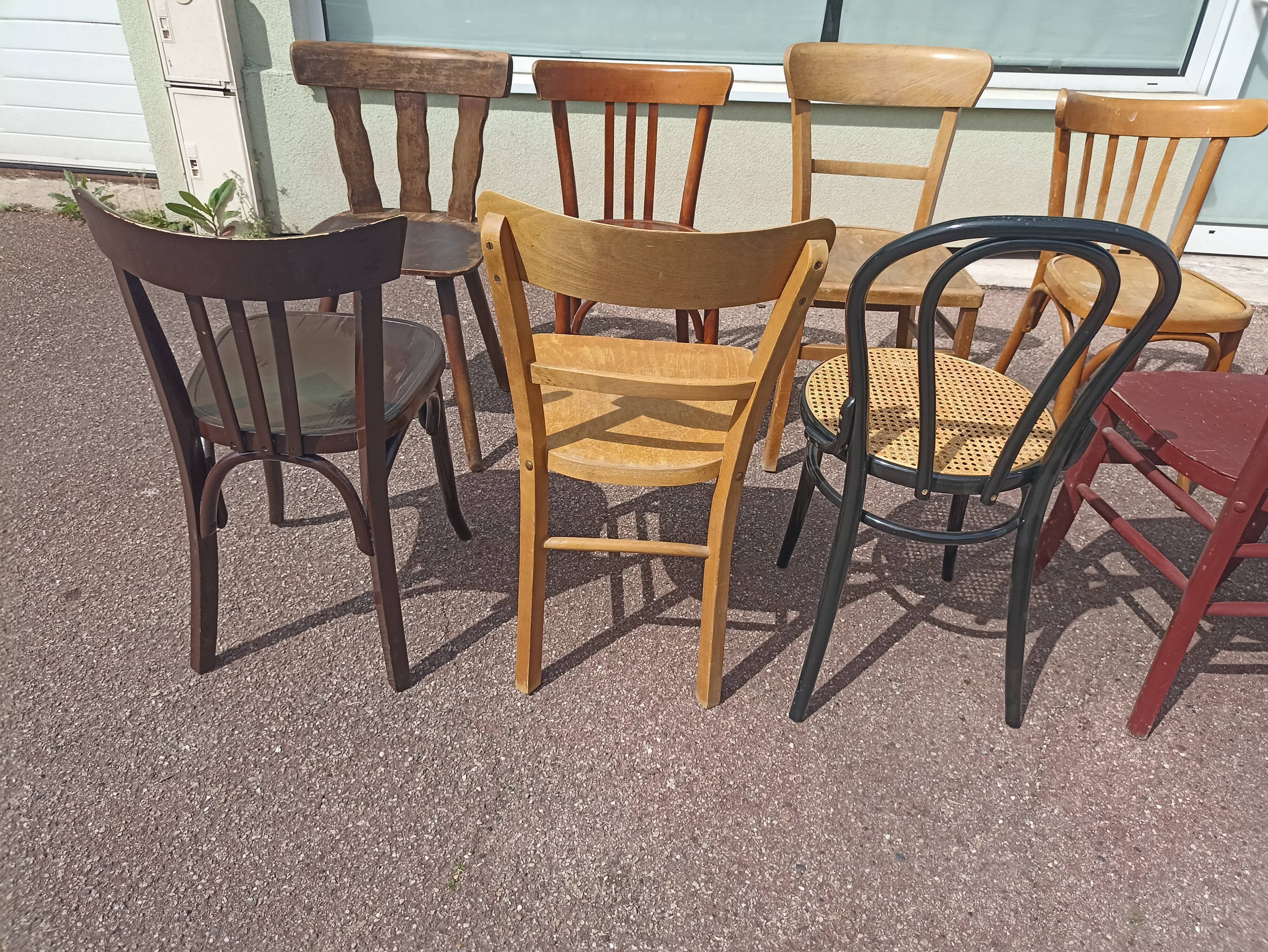 Set of 12 mismatched wooden bistro chairs