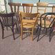 Set of 12 mismatched wooden bistro chairs