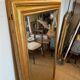Grand miroir ancien en bois patiné doré